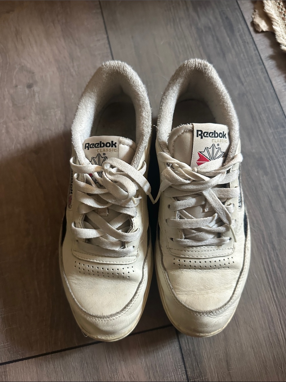 Reebok Low-Top Sneakers in Off-White with Black Trim and Red Logo